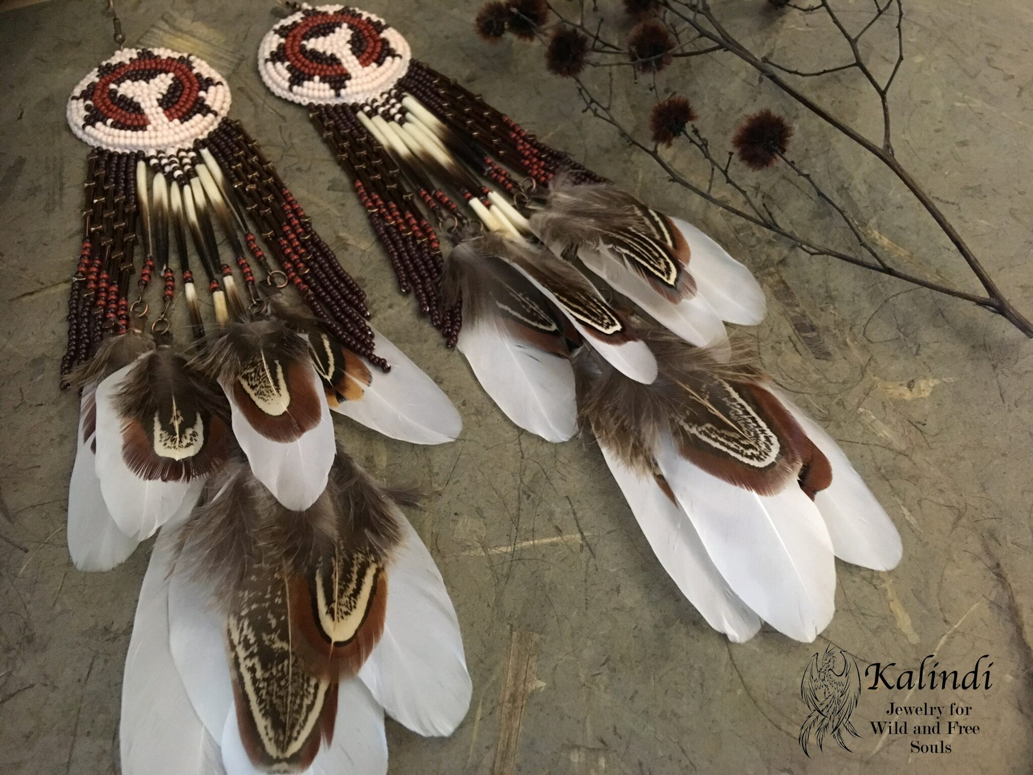 Earrings with handmade bead embroidery with feathers