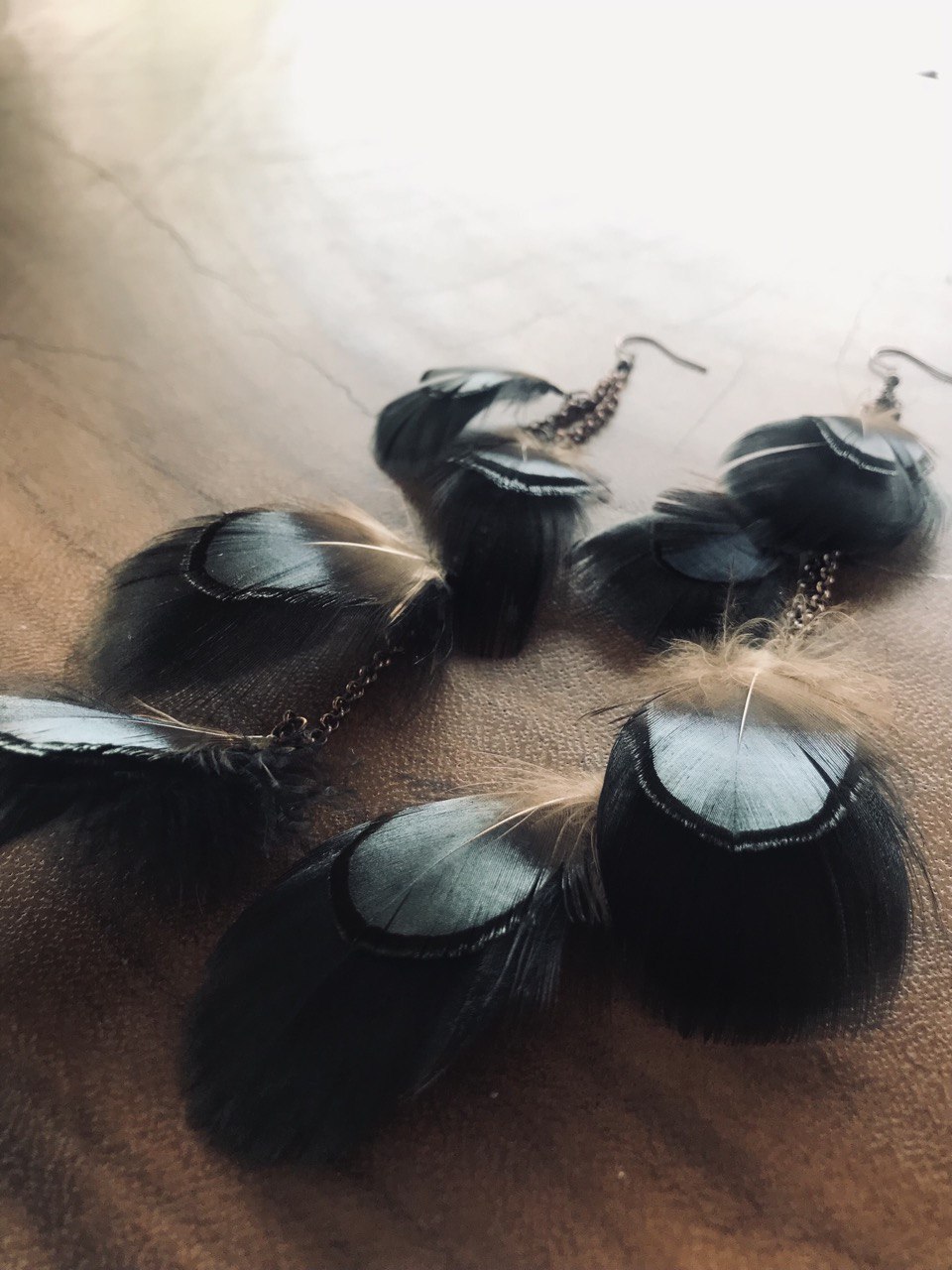 green feather earrings