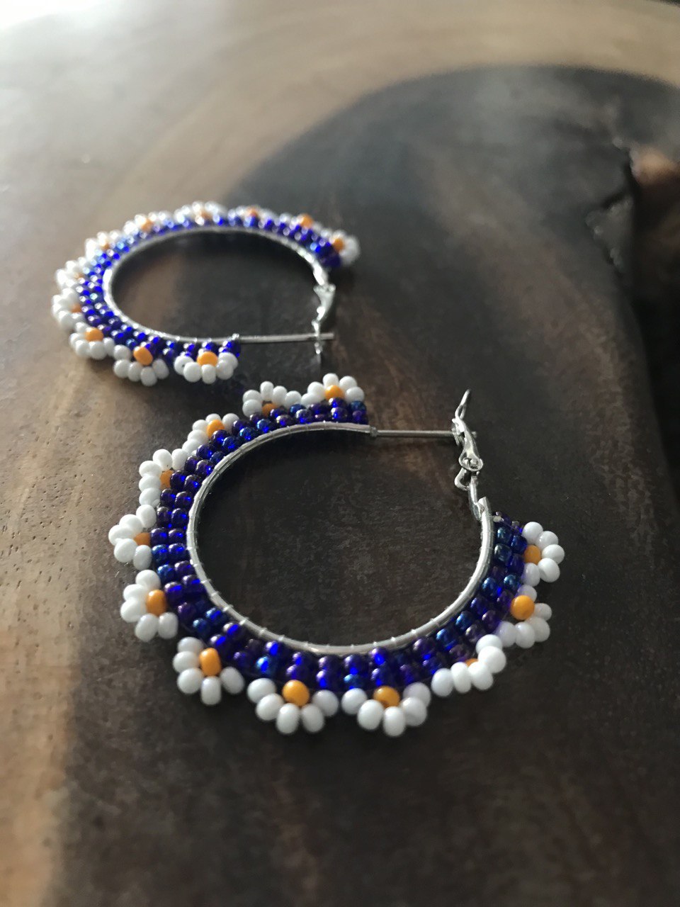 Handmade Beaded Hoop Earrings with Light Blue, White, and Light Orange Flowers